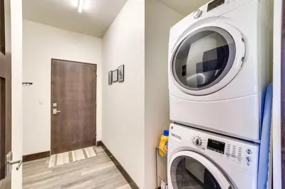 a laundry room with a washer and dryer at Hike, Ski, Golf, and Fish Silverthorne Townhome! in Silverthorne
