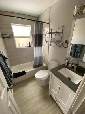 a small bathroom with a toilet and a sink at 2br 1 bath Upstairs AC WD Barnum West Near Belmar in Denver