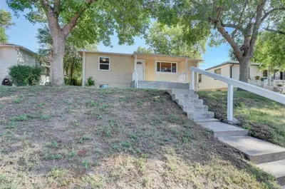 a house with a staircase in front of a yard at 2br 1 bath Upstairs AC WD Barnum West Near Belmar in Denver