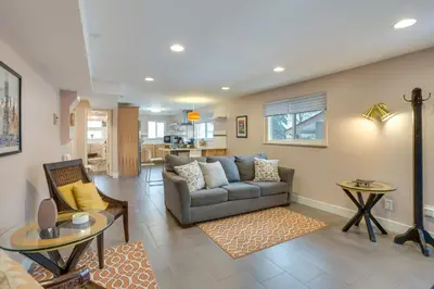 a living room with a couch and a table at 9 Mi to Dtwn Quiet South Denver Apartment in Denver