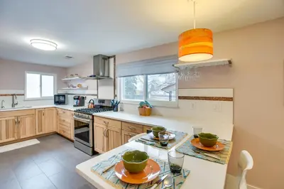 a kitchen with a counter with two plates on it at 9 Mi to Dtwn Quiet South Denver Apartment in Denver
