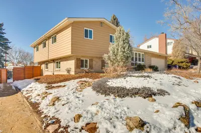 a house with snow in front of it at 9 Mi to Dtwn Quiet South Denver Apartment in Denver