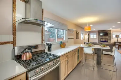 a kitchen with a stove and a counter top at 9 Mi to Dtwn Quiet South Denver Apartment in Denver