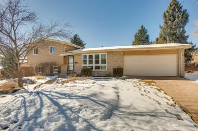 a house with a garage in the snow at 9 Mi to Dtwn Quiet South Denver Apartment in Denver
