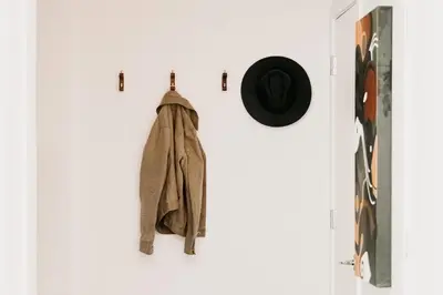 a coat hanging on a wall next to a door at Gallery Retreat - Skyline Views - Zuni Lofts in Denver