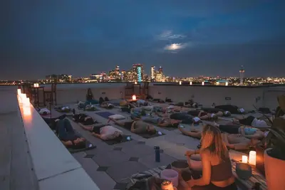 a group of people laying on the roof of a building at Modern Eclectic Penthouse Loft - Zuni Lofts in Denver