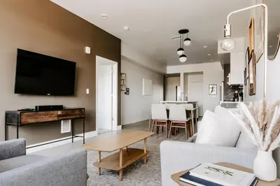 a living room with a couch and a table at Contemporary Cool Lifestyle Loft - Zuni Lofts in Denver