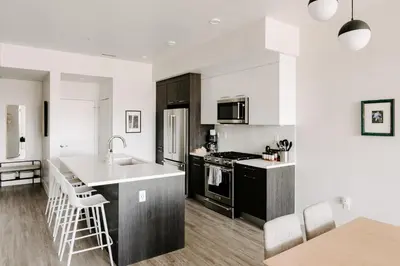 a kitchen with a sink and a counter top at Contemporary Cool Lifestyle Loft - Zuni Lofts in Denver