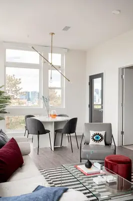 a living room with a couch and a table at A Luxe Point of View - Pet-Friendly - Zuni Lofts in Denver