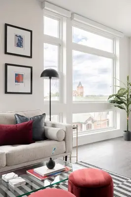 a living room with a couch and a large window at A Luxe Point of View - Pet-Friendly - Zuni Lofts in Denver