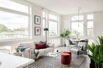 a living room with a couch and a table at A Luxe Point of View - Pet-Friendly - Zuni Lofts in Denver