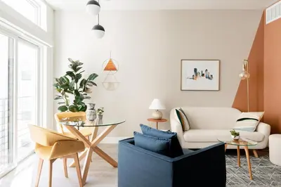 a living room with a table and chairs at Colorful Western Vibe - Pet-Friendly - Zuni Lofts in Denver