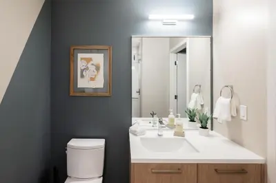 a bathroom with a white sink and a mirror at Colorful Western Vibe - Pet-Friendly - Zuni Lofts in Denver