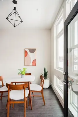 a dining room with a table and chairs at Modern Lifestyle - City View - Pet-Friendly - Zuni in Denver