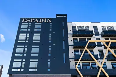 a tall building with the words reputation on it at On Cloud 9 - Curated Lifestyle Loft - Zuni Lofts in Denver