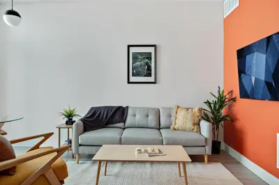 a living room with a couch and a table at Modern Lifestyle Loft with View - Zuni Lofts in Denver