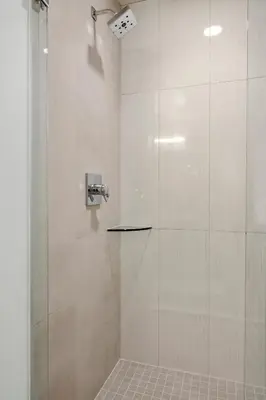 a bathroom with a shower with a glass door at Modern Lifestyle Loft with View - Zuni Lofts in Denver