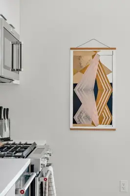 a kitchen with a picture hanging on the wall at Modern Lifestyle Loft with View - Zuni Lofts in Denver