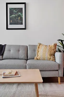 a living room with a couch and a coffee table at Modern Lifestyle Loft with View - Zuni Lofts in Denver