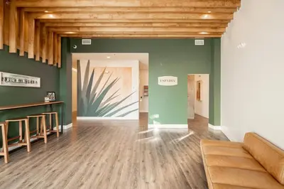 a room with green walls and a wooden ceiling at Fifty Shapes of Modern - Skyline Loft - Zuni Lofts in Denver