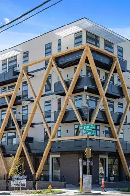 a large building with wooden beams on the side of it at Fifty Shapes of Modern - Skyline Loft - Zuni Lofts in Denver