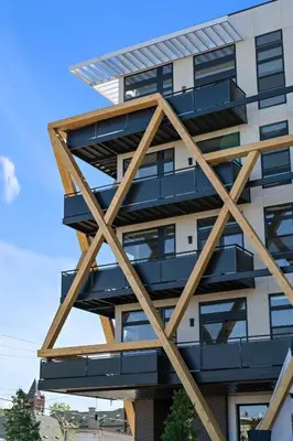 a building with wooden balconies on the side of it at New Spacious Modern Loft - Center of LoHi in Denver