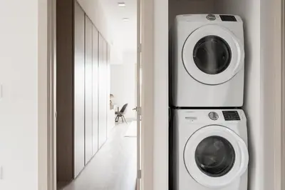 a washing machine and a dryer in a room at City Views! - Chic Jefferson Park Condo - Tesoro in Denver