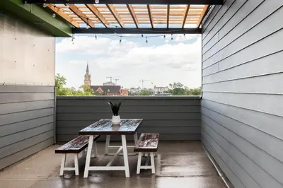 a table and two chairs in a room with a window at Urban Oasis - Rooftop Delight - Peloton - RiNo in Denver