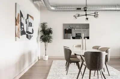 a dining room with a table and chairs at Gameday Oasis - Private Balcony - Jefferson Park - Tesoro in Denver