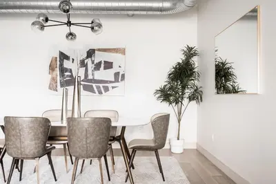 a dining room with a table and chairs at Gameday Oasis - Private Balcony - Jefferson Park - Tesoro in Denver
