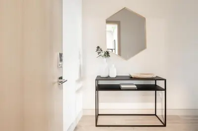 a table with a mirror next to a door at Contemporary Condo - Grill - Balcony - Tesoro in Denver