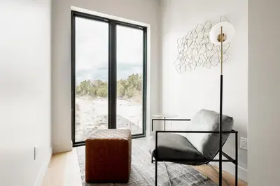 a living room with a chair and a glass table at Contemporary Condo - Grill - Balcony - Tesoro in Denver