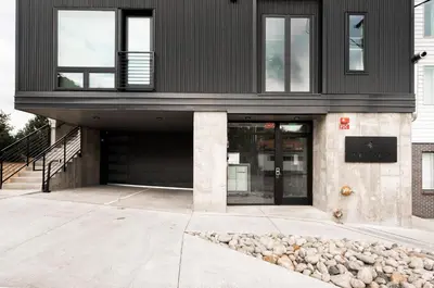 a black house with a black roof at Contemporary Condo - Grill - Balcony - Tesoro in Denver