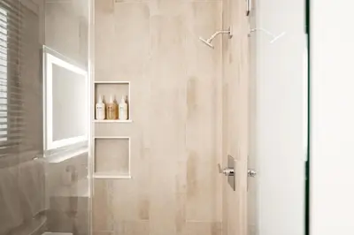 a bathroom with a shower with a glass door at Contemporary Condo - Grill - Balcony - Tesoro in Denver
