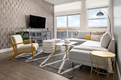 a living room with a couch and a tv at New! Sprawling Floor Plan - Central LoHi - Peloton in Denver