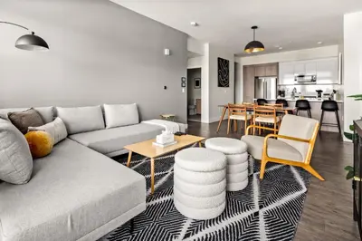a living room with a couch and a table at New! Sprawling Floor Plan - Central LoHi - Peloton in Denver