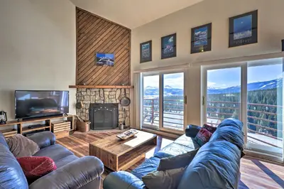 a living room with a couch and a tv and a fireplace at Mtn-View Silverthorne Gem with Shared Hot Tub in Silverthorne