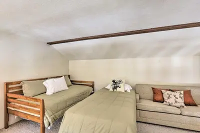 a bedroom with two beds and a couch at Mtn-View Silverthorne Gem with Shared Hot Tub in Silverthorne