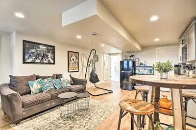 a living room with a couch and a table at Relaxing Loveland Escape with Mountain Views in Loveland
