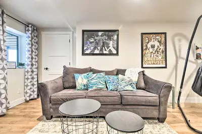 a living room with a couch and two tables at Relaxing Loveland Escape with Mountain Views in Loveland