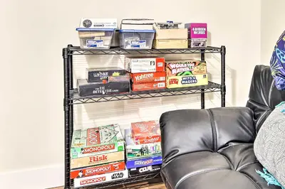 a shelf with food on it next to a couch at Relaxing Loveland Escape with Mountain Views in Loveland