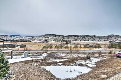 a view of a field with trees in the snow at Relaxing Loveland Escape with Mountain Views in Loveland