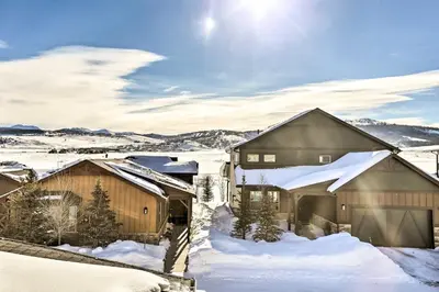 a house in the snow with snow covered roofs at Hike and Ski Stunning Home with Hot Tub in Granby! in Granby