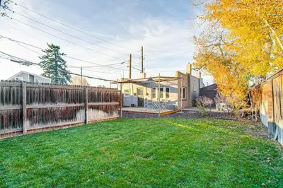 a yard with a fence and a house at Stay and Play in South Denver! 7 Mi to LoDo in Denver