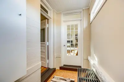 a hallway with a white door and a window at Stay and Play in South Denver! 7 Mi to LoDo in Denver
