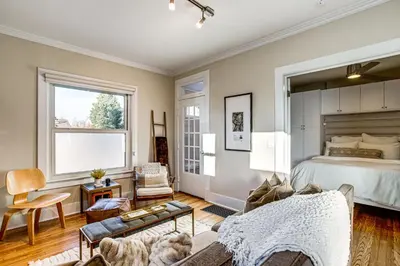 a bedroom with a bed and a living room at Stay and Play in South Denver! 7 Mi to LoDo in Denver