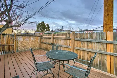 a table and chairs on a wooden deck with a fence at Walk to Tennyson St! Pet-Friendly Denver Home in Denver