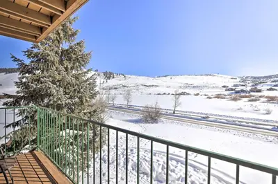 a balcony with snow on the ground and a tree at Granby Studio with Mtn Views Near Hiking and Skiing! in Granby