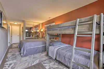 a bedroom with two bunk beds in a room at Granby Studio with Mtn Views Near Hiking and Skiing! in Granby
