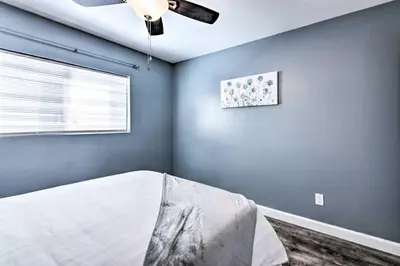 a bedroom with a bed and a ceiling fan at Loveland Duplex with Large Yard 2 Mi to Dtwn in Loveland
